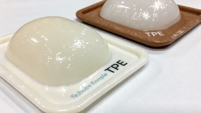 A collection of colorful TPE toothbrush grips next to a clear, medical-grade silicone tube