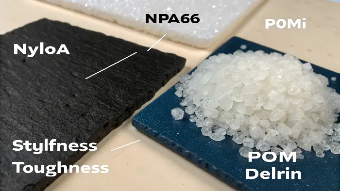 A side-by-side comparison of a white POM gear and a black Nylon PA66 clip