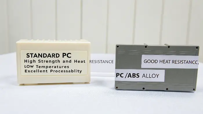 A close-up of a high-tech electronics housing made from PC/ABS alloy, showcasing its fine finish.