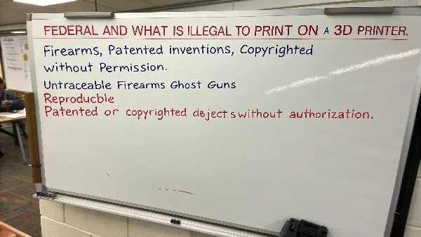 A gavel and a 3D printer, symbolizing legal regulations in 3D printing.
