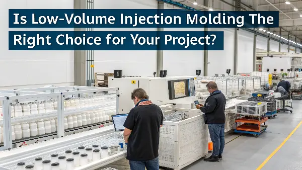 A close-up of a low-volume injection mold with a CNC machine in the background